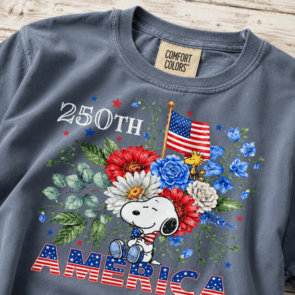 1_371fc981-fc43-4144-b5c6-912cbf9c2799 - AuraNations - Comfort Colors 250th America Patriotic Sitting Floral Dog T-Shirt - Blue Jean / S - 250TH ANNIVERSARY, ALL, COMFORT COLORS, NO CUSTOM, PRODUCTS, SNPY, TSHIRT