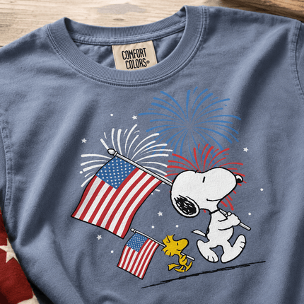 1_d7c8e839-87e3-41eb-9c70-4663ffb12e0e - AuraNations - Comfort Colors Fireworks Patriotic Marching Flag Dog T-Shirt - Blue Jean / S - 250TH ANNIVERSARY, ALL, COMFORT COLORS, NO CUSTOM, PRODUCTS, SNPY, TSHIRT
