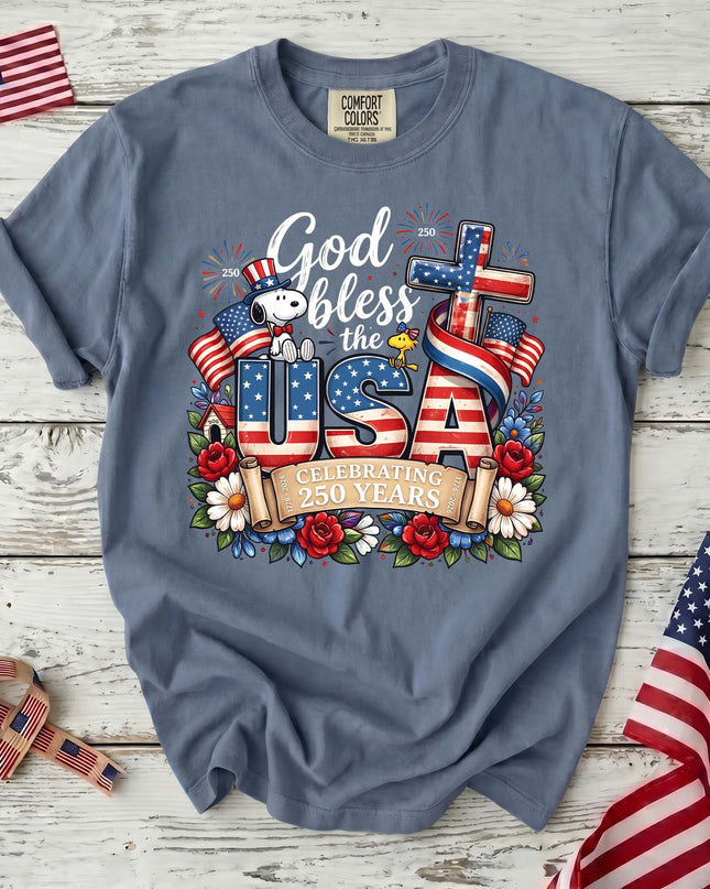JEAN_e9d69f9f-4b44-4ed2-84c0-bfc2812f11e7 - AuraNations - Comfort Colors God Bless The USA Celebrating 250 Years Cross Dog T-Shirt - Blue Jean / S - 250TH ANNIVERSARY, ALL, COMFORT COLORS, NO CUSTOM, PRODUCTS, SNPY, TSHIRT
