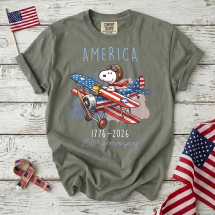 MOSS_61f945e0-5936-4f51-b5ca-e44d25753c9e - AuraNations - Comfort Colors America 1776-2026 250th Anniversary Patriotic Airplane Dog T-Shirt - Moss / S - 250TH ANNIVERSARY, ALL, COMFORT COLORS, NO CUSTOM, PRODUCTS, SNPY, TSHIRT